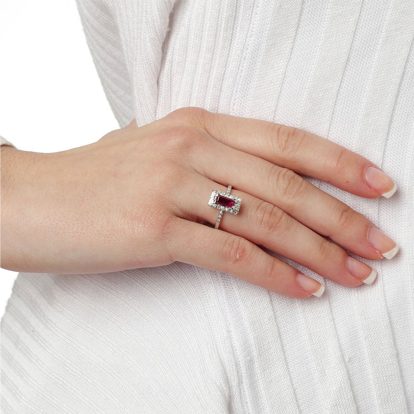 Ring 18KT White Gold with a Baguette Ruby Solitaire and Brilliant cut Diamonds. Product Code : 1118DA29WR