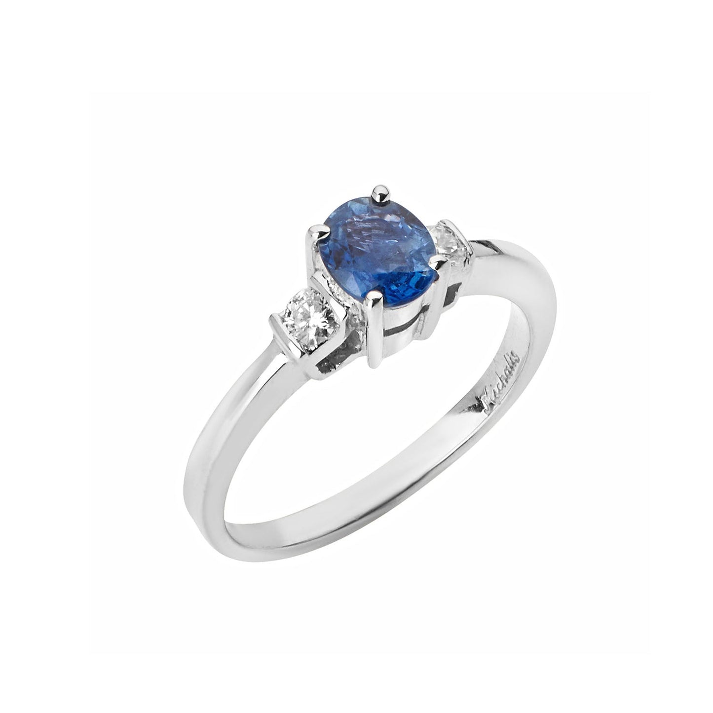 Ring 18KT White Gold with an Oval Sapphire and Brilliant cut Diamonds. Product Code:1402DW493S