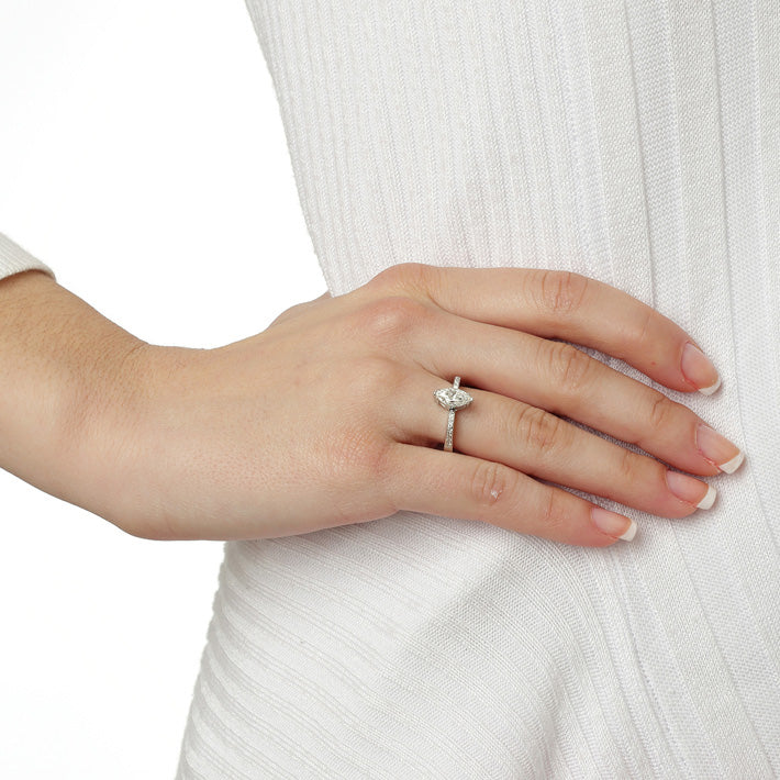 Marquise cut diamond solitaire 18KT white gold with brilliant cut diamonds on the sides. Product Code : 107D59