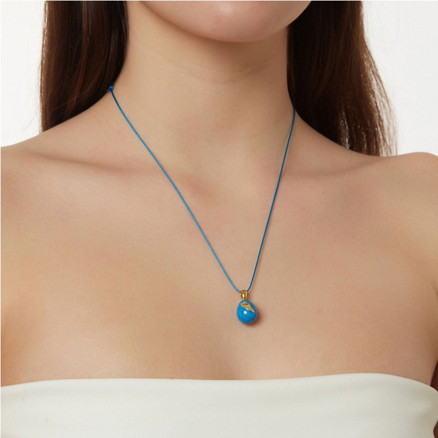 “Angel Wings” Easter Egg Pendant on a Cord. Product Code: 92MAYG23 Aqua Blue