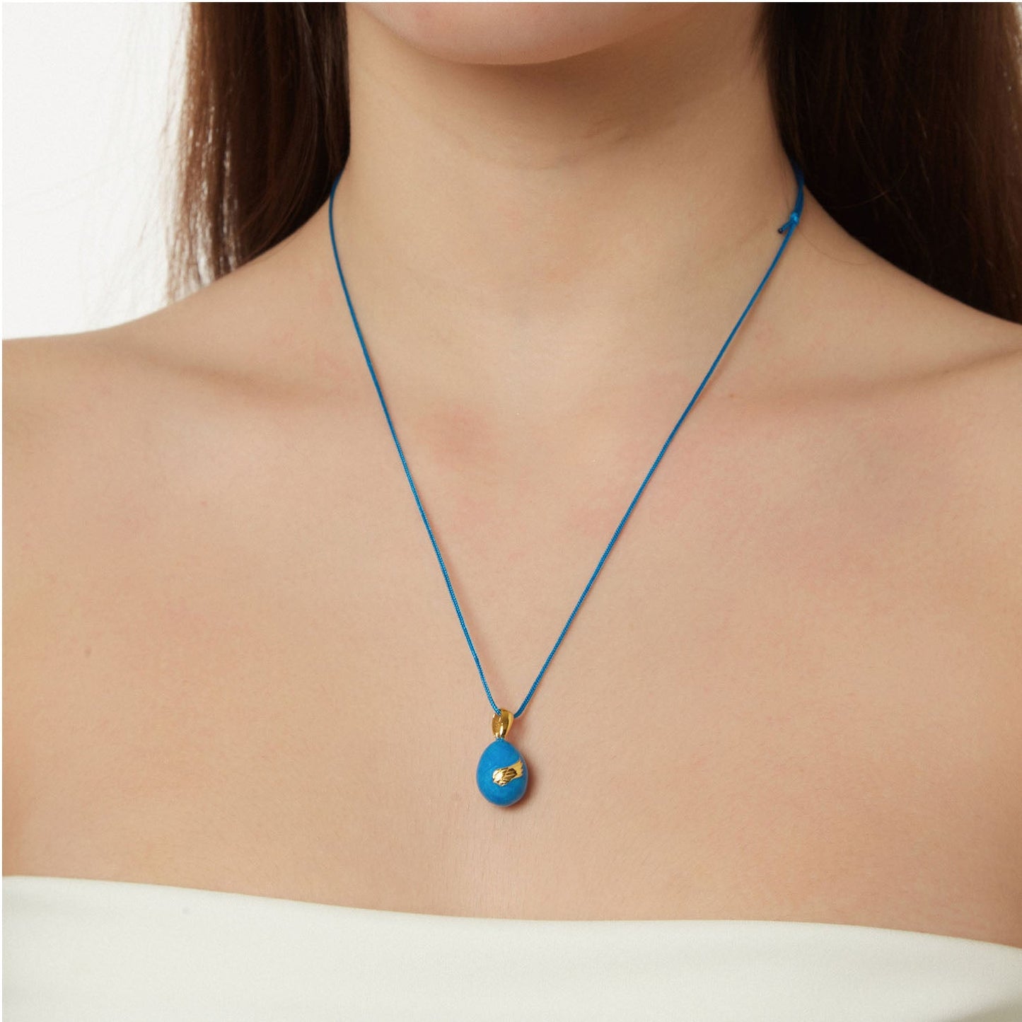 “Angel Wings” Easter Egg Pendant on a Cord. Product Code: 91MAYG23 Aqua Blue