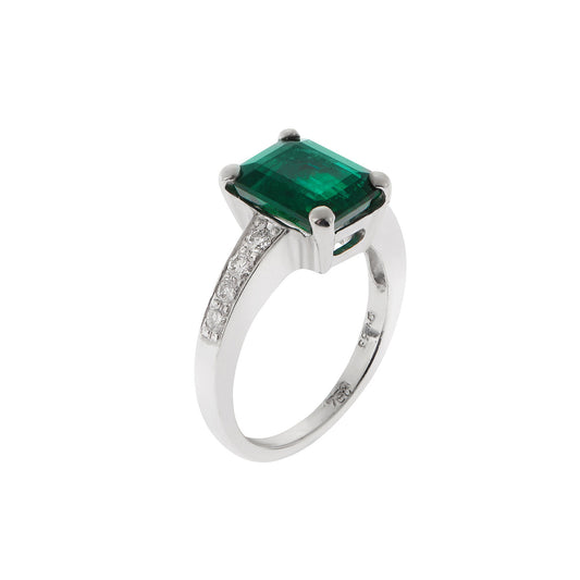 Ring 18KT White Gold with an Emerald cut Emerald and Brilliant cut Diamonds.  Product Code : 1163DW057