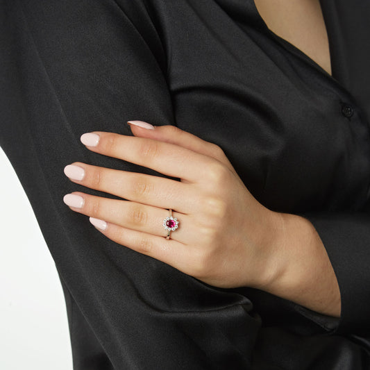 Ring 18KT White Gold with an Oval Ruby and Brilliant cut Diamonds. Product Code :1395DW55R