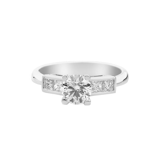 Brilliant cut diamond 18KT white gold solitaire ring with princess cut diamonds on the side. Product Code : 196D65
