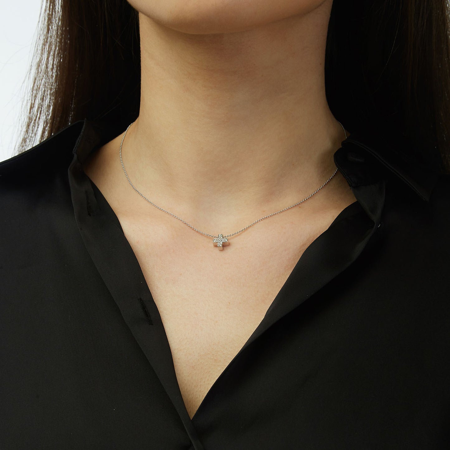 Diamond cross 18KT white gold on a chain.   Product Code: 282ST85W.