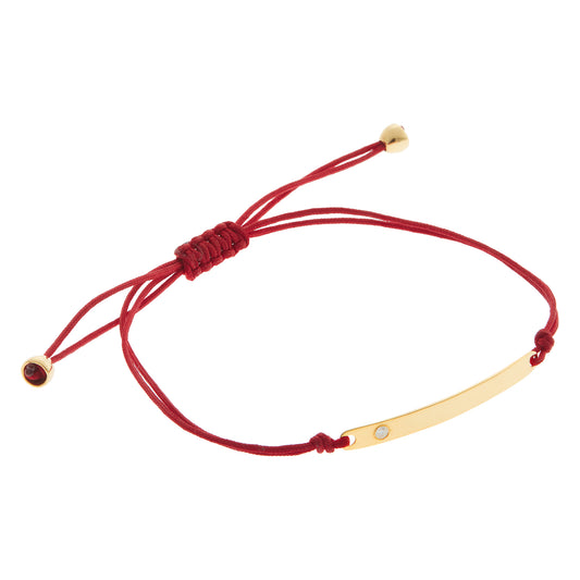 Engravable KT18 Yellow Gold and  Diamond Tag Bracelet  attached to a Cord.