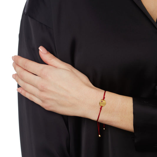 Engravable KT18 Pink Gold and  Ruby Tag Bracelet  attached to a Cord.
