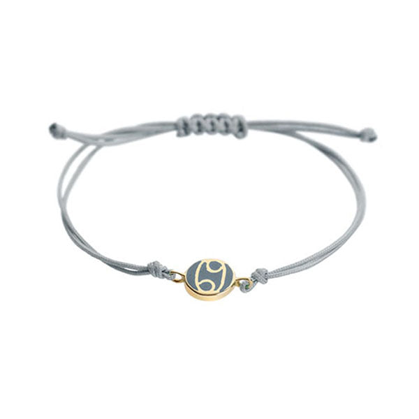 Cancer 18-carat yellow gold, enameled charm bracelet.