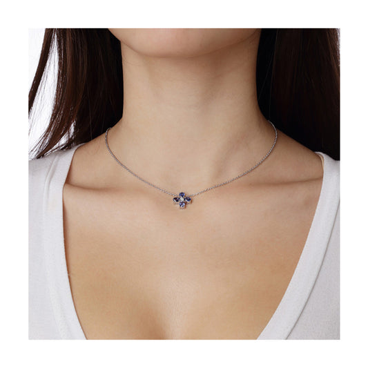 Sapphire and diamond cross 18k white gold on a chain.
