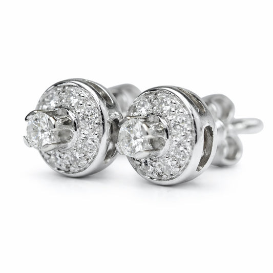 Halo Earrings white gold 18k with center diamonds 0,18 carats and 0,22 carats. Total weight 2,40gr. Product Code:23SK97