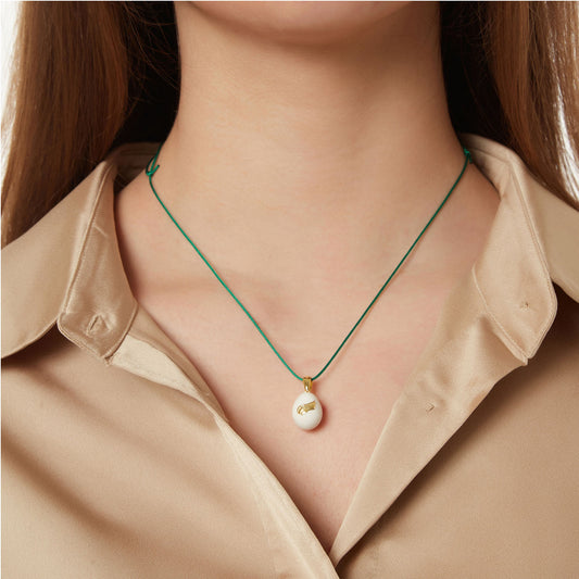 “Angel Wings”  Easter Egg Pendant  on a Cord. Product Code: 91MAYG23 Ivory