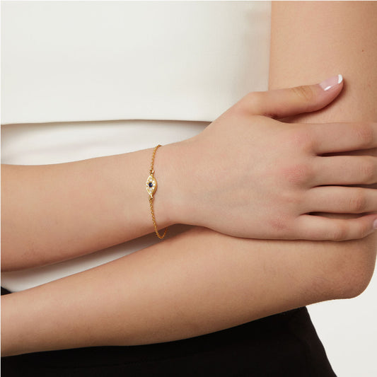 Bracelet "Lucky Eye "18KT Yellow Gold with a Brilliant cut Diamonds and a Sapphire.